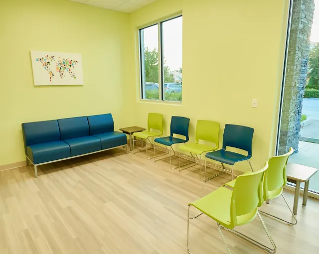 The blue sofa and bright chairs in our Wesley Chapel lobby